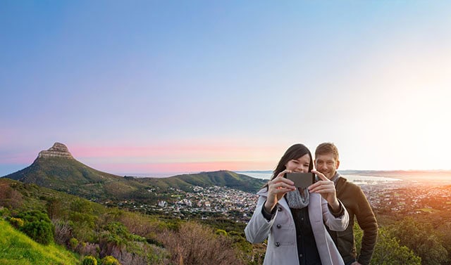 Couple posting to Instagram in Cape Town
